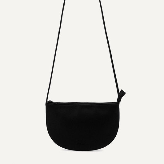 black half moon bag on white background